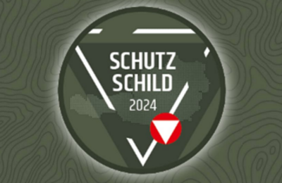 Das Bild zeigt ein Dreieck mit dem Schriftzug "Schutzschild 2024" sowie das Logo des Österr. Bundesheeres.